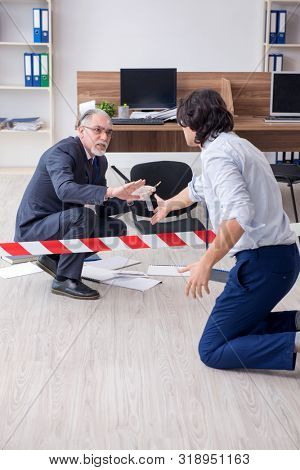 Forensic investigator investigating theft in the office