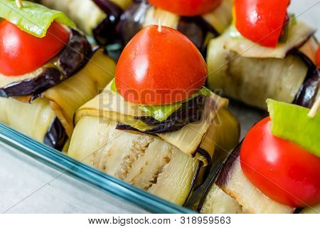Turkish Islim Kofta Kebab With Meatballs And Cherry Tomatoes Wrapped In Eggplant / Aubergine Slices.