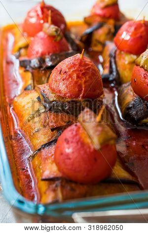 Turkish Islim Kofta Kebab With Meatballs And Cherry Tomatoes Wrapped In Eggplant / Aubergine Slices.