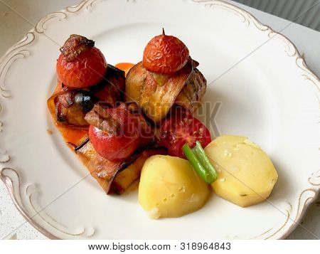 Turkish Islim Kofta Kebab With Meatballs And Cherry Tomatoes Wrapped In Eggplant / Aubergine Slices.