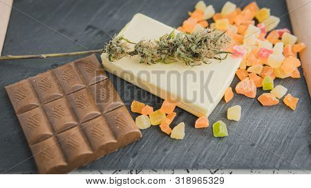 Preparing To Cooking Cake With Cannabis Butter. Concept Of Using Marijuana In Food Industry.
