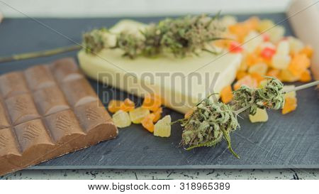 Preparing To Cooking Cake With Cannabis Butter. Concept Of Using Marijuana In Food Industry.
