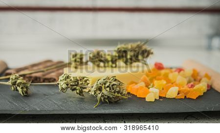 Preparing To Cooking Cake With Cannabis Butter. Concept Of Using Marijuana In Food Industry.