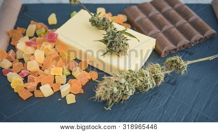 Preparing To Cooking Cake With Cannabis Butter. Concept Of Using Marijuana In Food Industry.