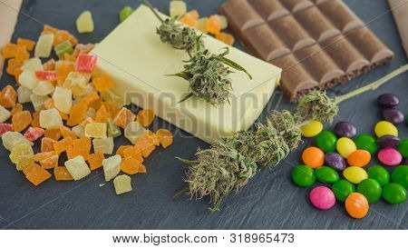 Preparing To Cooking Cake With Cannabis Butter. Concept Of Using Marijuana In Food Industry.
