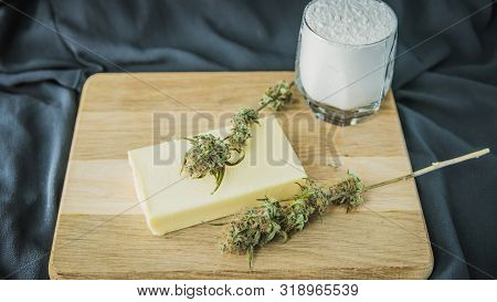 Preparing To Cooking Cake With Cannabis Butter. Concept Of Using Marijuana In Food Industry.