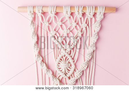 A Handmade 100% Cotton Macrame Wall Decoration Hanging On Pink Wall. Decoration For The Interior. Tr