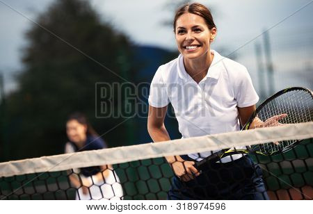 Fit Happy Poeple Playing Tennis Together. Sport Concept