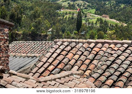 Antique clay roof tiles of the historical houses in the small town of Mongui in Colombia