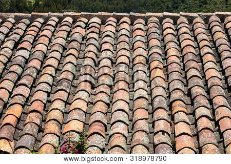 Antique clay roof tiles of the historical houses in the small town of Mongui in Colombia