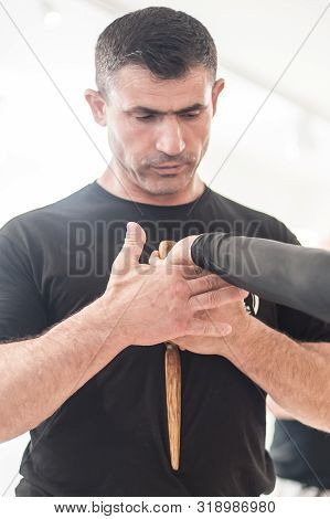 Kapap Instructor Altin Qoku, Demonstrates Disarm Techniques Against Knife Attack