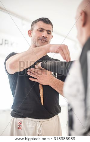 Kapap Instructor Altin Qoku, Demonstrates Disarm Techniques Against Knife Attack