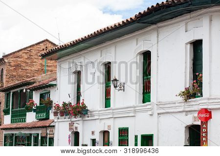 Mongui, Colombia - August, 2019: Beautiful Facade Of The Houses At The Small Town Of Mongui In Colom