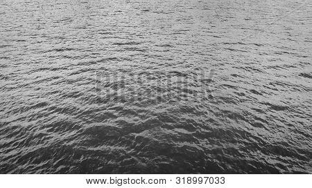 Dramatic Aerial Dark Water Surface Fof The Background
