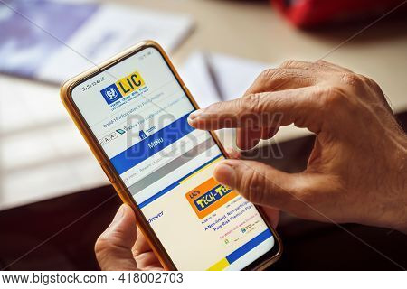 West Bengal, India, January 28, 2021 : Person Checking Out Lic Official Website For Health And Life 