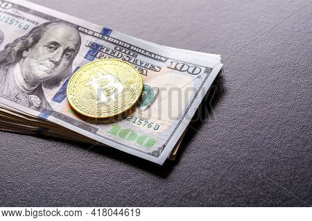 Golden Bitcoin Lies On The Banknotes.new Virtual Money. Crypto Currency Top View. Real Coins Of Bitc