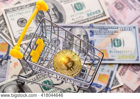 Golden Bitcoin Lies On The Banknotes.new Virtual Money. Crypto Currency Top View. Real Coins Of Bitc