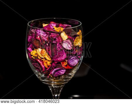 Colored Dried Flower Petals In A Glass