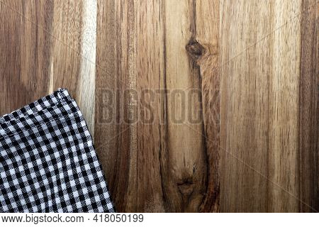 Beautiful Acacia Wood Texture With Napkin. Rustic Look With Veins, Knots And Copy Space.