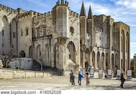 France, Avignon, March, 2021 - Tourists Visiting The Palais Des Papes Dominates The Avignon City, Th