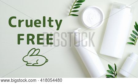 Spa Cosmetic Bottle Containers And Cream Jar With Green Leaves. Cruelty Free Cosmetics Set On Green 