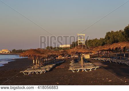 Beautiful Black Beach With Coast And Sea In Vlichada With Blue Sky Background With White Clouds And 