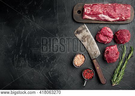 Fresh Raw Beef Steak Mignon Whole Cut Set , With Old Butcher Cleaver Knife, On Black Stone Backgroun