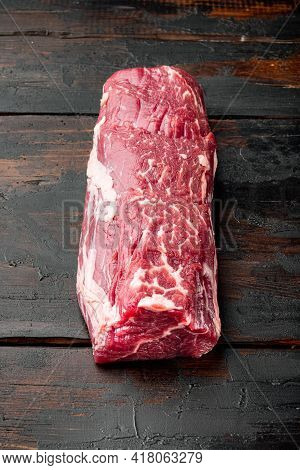 Fresh And Raw Beef Meat. Whole Piece Of Tenderloin With Steaks Set, On Old Dark  Wooden Table Backgr