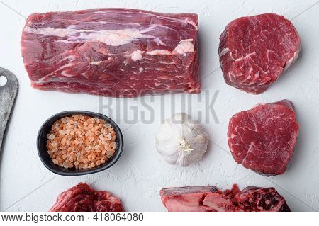 Tenderloin Steak. Raw Beef Steak Cut Set, On White Stone  Background, Top View Flat Lay