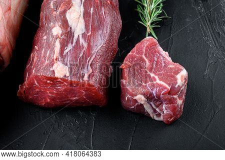 Tenderloin, Or Eye Fillet Cut Raw Marbled Beef Meat Set, On Black Stone Background