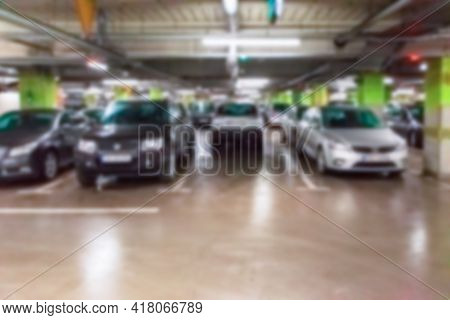 Parking Garage Blurred. Empty Road Asphalt Background In Soft Focus. Car Lot Parking Space In Underg
