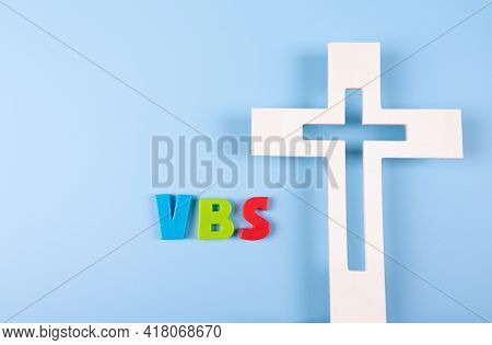 Church Background With Wood Cross Next To Abbreviation 