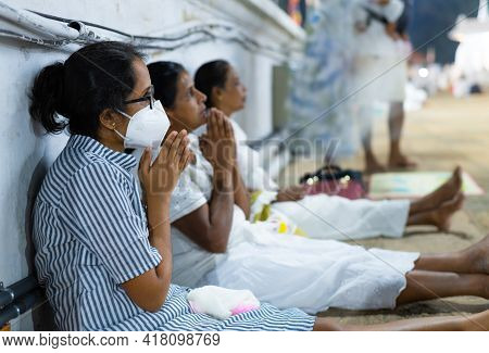 Anuradhapura, Sri Lanka - 03 30 2021: Buddhist Devotees Praying At The Ruwanwelimahasaya, Wearing A 