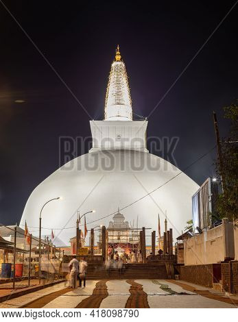 Ruwanwelisaya Stupa Glowing In The Night, It Is A Hemispherical Structure And Containing Sacred Budd