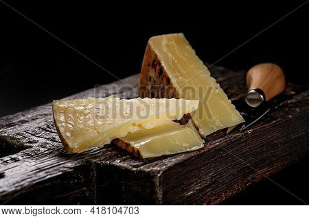 Close-up Of Cheddar Cheese. Semi-soft Aged Cow's Milk Cheese According To An Old English Recipe. Pie