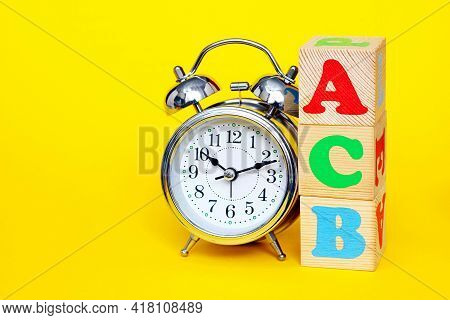 Dyslexia Concept. Abc - Acb - Not Consistently The First Letters Of The English Alphabet On Wooden T
