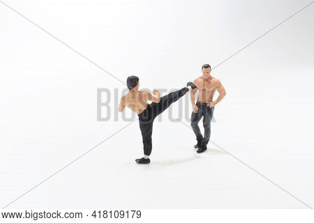 A Mini  Kung Fu Martial  Fighters  With Shirtless Stong Man