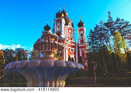 Fountain In The Churchyard . Famous Monastery And Marble Fountain In Village Curchi From Moldova