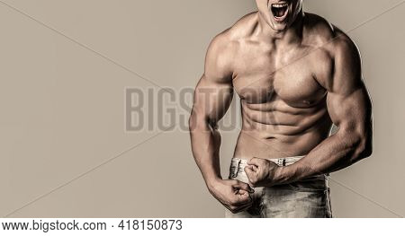 Muscular Man Screaming. Screaming Man With Well Trained Body, Biceps, Abs And Pecs And Wearing. Musc