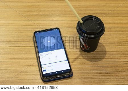 Belars, Nvopolotsk - April 20, 2021: Yandex Taxi On The Phone Display On Wooden Table