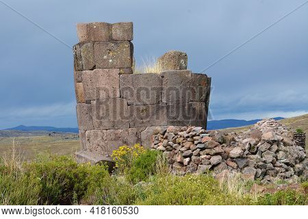 Sillustani Tombs In The Peruvian Andes Near Town Puno, Peru.\nan Inca Burial Tower At The Sillustani
