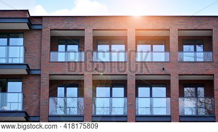 Modern Brick And Glass Facade Of The Office Building.  A Contrasting Combination Of Sky And Brick Te