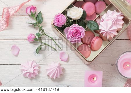 Rose, Desset And Burning Candles On White Wooden Background
