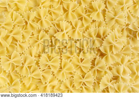 Farfalle Bow Tie Wholewheat And Durum Wheat Pasta. Butterflies Shape Uncooked Food Background. Itali