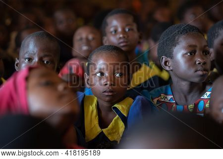Mzuzu, Malawi. 30-05-2018. Portrait Of A Black Child Attending School While The Teacher Is Giving Cl
