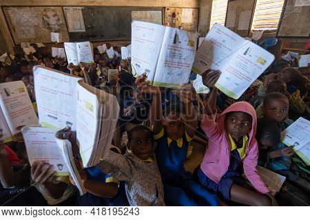 Mzuzu, Malawi. 30-05-2018. Afro-descendent Children Attending School Proudly Showing Their Teacher T