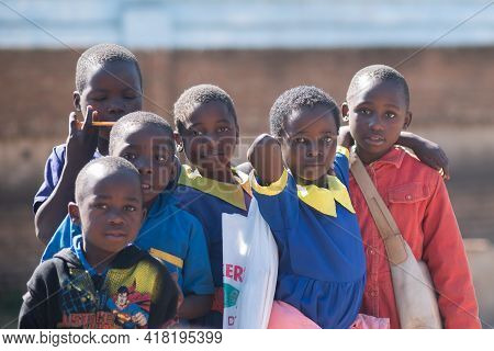 Mzuzu, Malawi. 30-05-2018. Beautiful Portrait Of 6 Children Looking At The Camera After School Finis