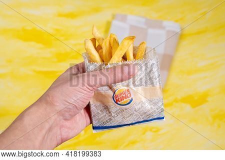 Tyumen, Russia-february 26, 2020: French Fries On A Yellow Background Of Burger King, A Fast Food Ch