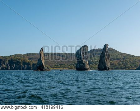 Exit On A Yacht To The Avacha Bay Of The Pacific Ocean. View Of The Rocks Three Brothers Are A Symbo