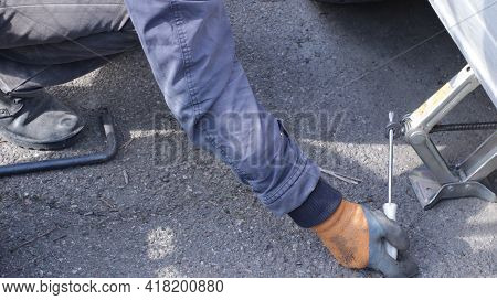 Manual Lifting Of The Car Body With A Screwdriver And A Folding Jack, Lifting The Car With A Jack To